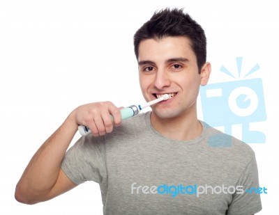 Young Man Brushing Teeth Stock Photo