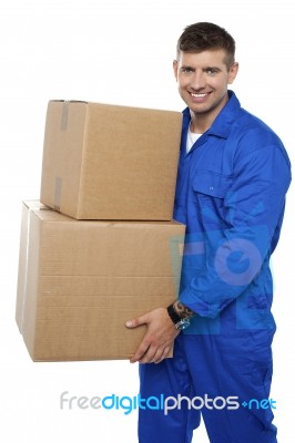 Young Man Carrying Cardboard Box Stock Photo