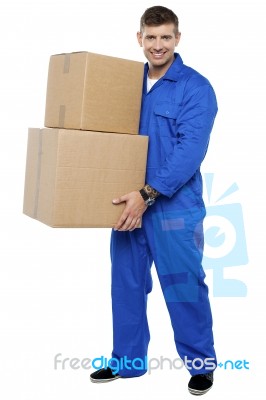 Young Man Carrying Cardboard Box Stock Photo