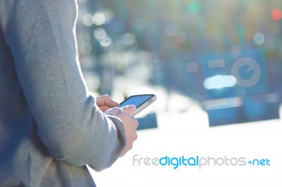 Young Man Chatting With Their Smartphone Stock Photo