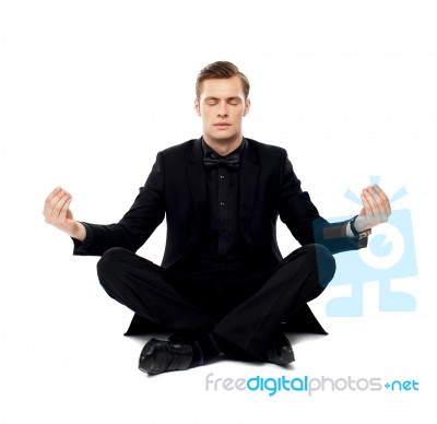 Young Man Doing Meditation Stock Photo