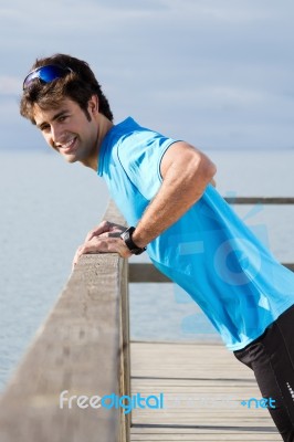 Young Man Doing Push Ups Near The Sea Stock Photo