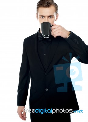 Young Man Drinking Coffee Stock Photo