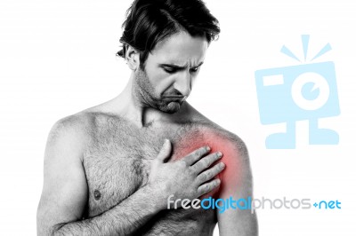 Young Man Having Chest Pain Stock Photo