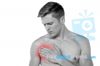 Young Man Having Chest Pain Stock Photo