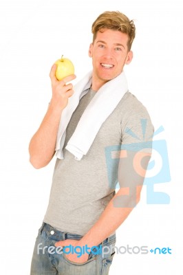 Young Man Holding An Apple Stock Photo