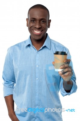 Young Man Holding Beverage Cup Stock Photo