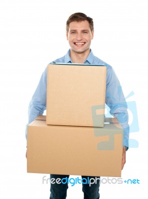 Young Man Holding Cardboard Box Stock Photo