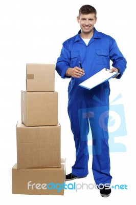 Young Man Holding Clipboard Stock Photo