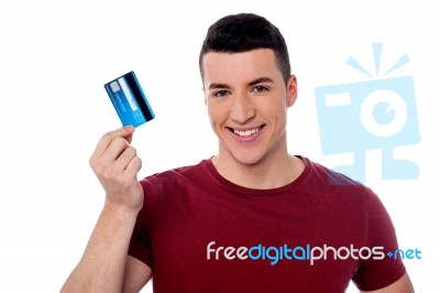 Young Man Holding Credit Card Stock Photo