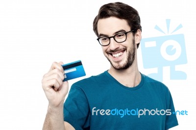 Young Man Holding Credit Card Stock Photo