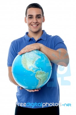 Young Man Holding Globe Map Stock Photo