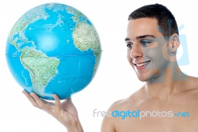 Young Man Holding Globe Map Stock Photo