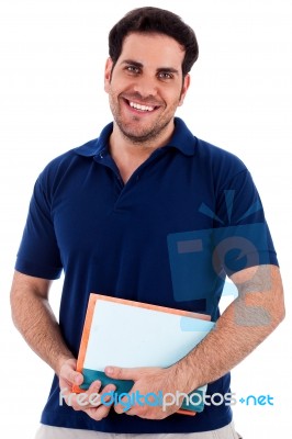 Young Man Holding Notepad Stock Photo