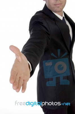 Young Man In Suit Offering To Shake The Hand Stock Photo