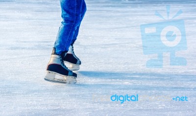 Young Man Is Skating. Feet Closeup Stock Photo