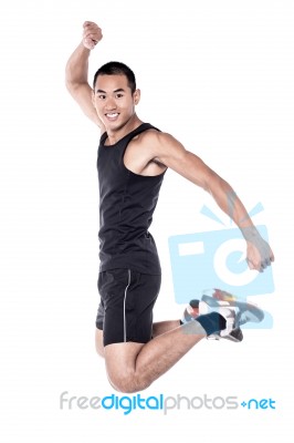 Young Man Jumping In The Air! Stock Photo