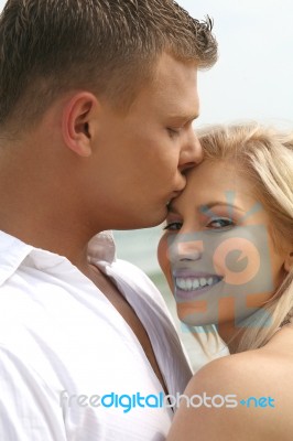 Young Man Kissing Stock Photo