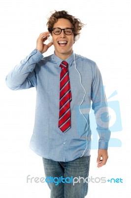 Young Man Listening To Music Stock Photo