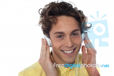 Young Man Listening With Headphones Stock Photo