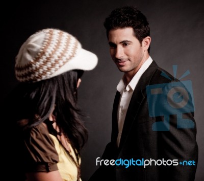 Young Man Looking At Woman Stock Photo