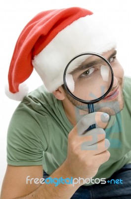 Young Man Looking Through Lens Stock Photo