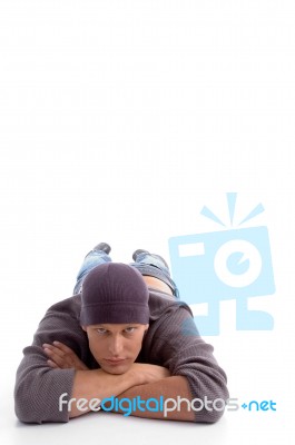 Young Man Lying On Floor Stock Photo