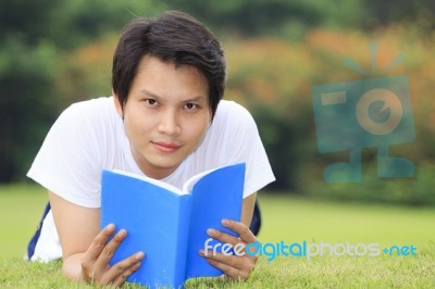 Young Man Open A Book Stock Photo