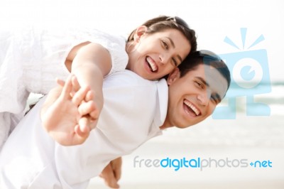 Young Man Piggyback His Girlfriend Stock Photo