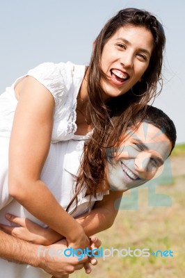 Young Man Piggyback His Girlfriend Stock Photo