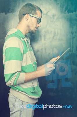 Young Man Read From Tablet Computer Stock Photo