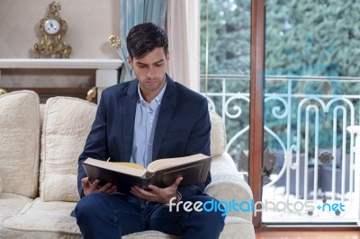 Young Man Reading A Book Stock Photo