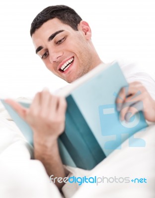 Young Man Reading Book Stock Photo