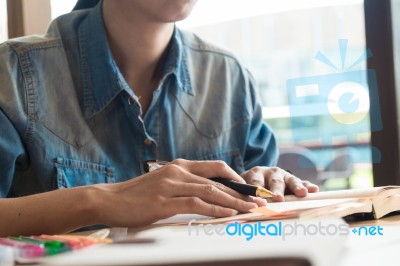 Young Man Reading Book At  Home Stock Photo