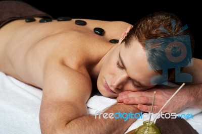 Young Man Relaxing On Massage Table Stock Photo