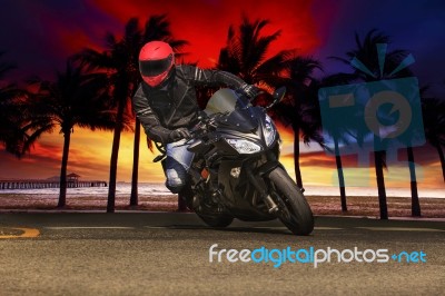 Young Man Riding Big Bike Motorcycle On Asphalt Roads Against Be… Stock Photo