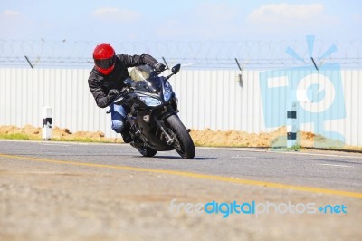 Young Man Riding Big Bike Motorcycle On Sharp Curve Asphalt Road… Stock Photo