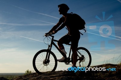 Young Man Riding Mountain Bike Stock Photo