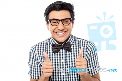 Young Man Showing Double Thumbs Up Stock Photo