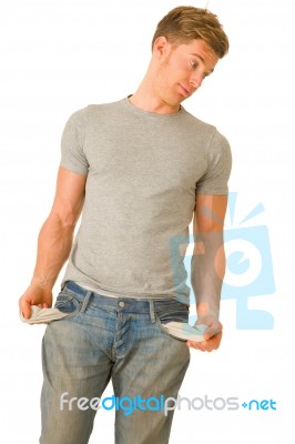 Young Man Showing Empty Pockets Stock Photo