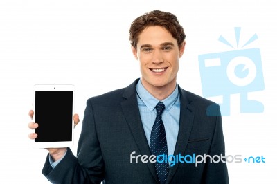 Young Man Showing Newly Launched Tablet Device Stock Photo