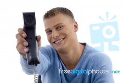 Young Man Showing Phone Receiver Stock Photo