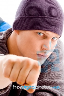 Young Man Showing Punching Gesture Stock Photo