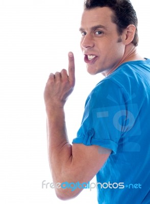 Young Man Showing Silent Gesture  Stock Photo