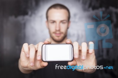 Young Man Showing Smartphone Stock Photo