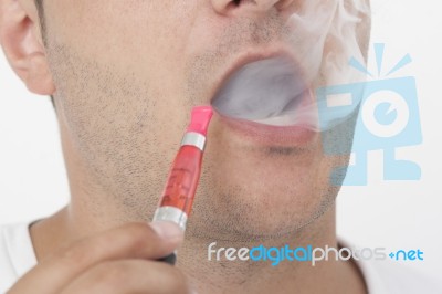 Young Man Smokin Electic Cigarette Stock Photo