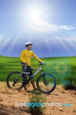 Young Man Standing Beside Moutain Bike ,mtb On Hill With Sun Shi… Stock Photo