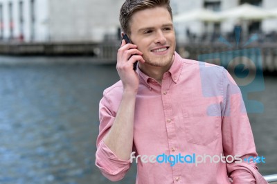 Young Man Talking On The Cell Phone Stock Photo