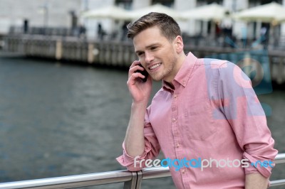 Young Man Talking On The Cell Phone Stock Photo