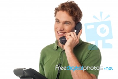 Young Man Talking On The Phone Stock Photo